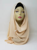 Beige chiffon hijab scarf displayed on mannequin, soft neutral flowy fabric, lightweight breathable modest headscarf for women, elegant drape chiffon hijab for everyday wear and special occasions, smooth nude tone scarf from Affordable Hijab USA