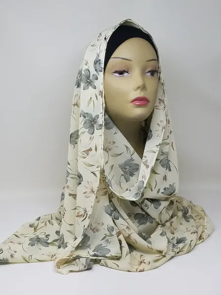Beige floral print hijab scarf for Muslim women, lightweight modest headscarf with soft floral pattern, elegant draped hijab for everyday wear, prayer, work, and modest fashion styling