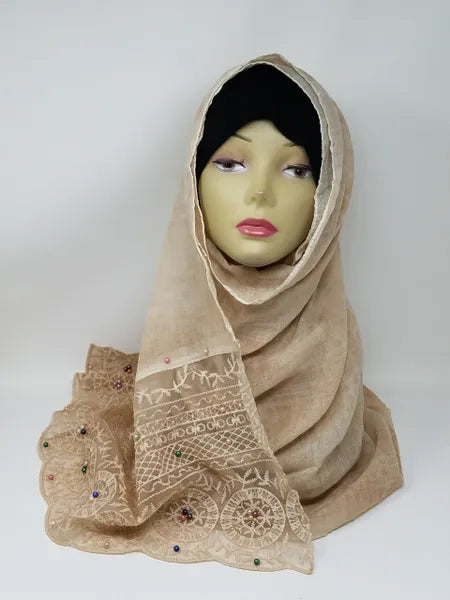 Beige lace hijab scarf on mannequin, elegant floral lace modest scarf, soft draped neutral hijab for women, dressy modest style