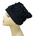 black turban headwrap with large flower design soft stretch fabric modest headwear for women elegant full coverage turban comfortable daily wear and special occasions