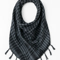 Black and gray keffiyeh scarf with traditional checkered pattern and tassel edges, lightweight square shemagh scarf displayed on white background, classic Arab style scarf from Affordable Hijab USA