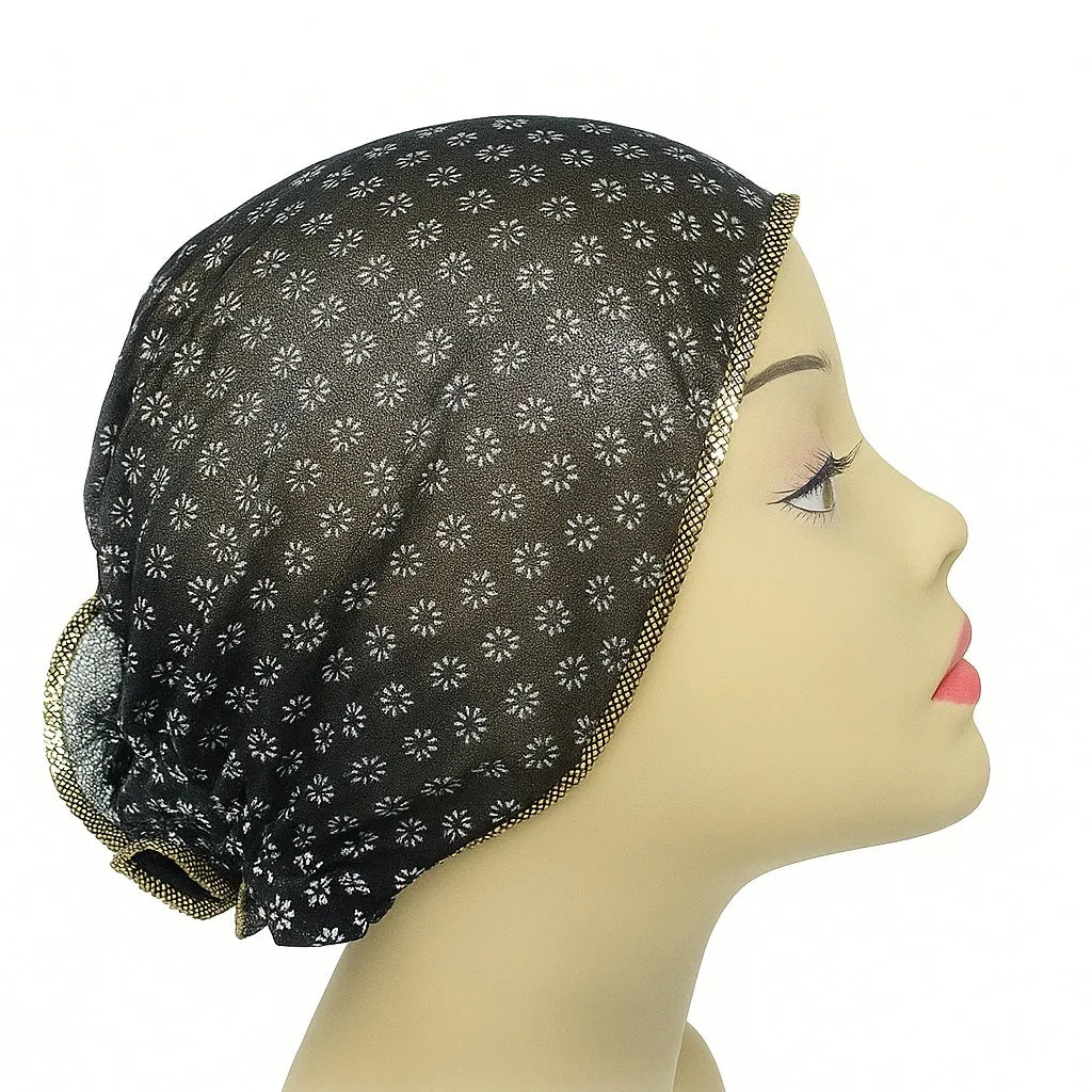 Black patterned sleep bonnet cap with decorative trim worn on mannequin head, modest hair covering bonnet for sleeping, hair protection cap for women, breathable headwear, modest fashion sleep bonnet from Affordable Hijab USA