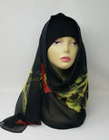 Black printed hijab scarf for women with multicolor pattern, lightweight modest fashion scarf, soft breathable hijab for everyday wear, Islamic headscarf for prayer and casual styling, elegant black hijab scarf with red and green accents, comfortable wrap for all day use