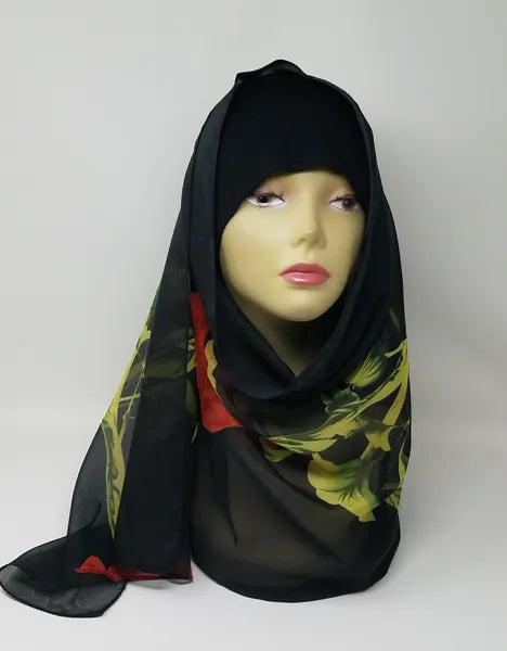 Black printed hijab scarf for women with multicolor pattern, lightweight modest fashion scarf, soft breathable hijab for everyday wear, Islamic headscarf for prayer and casual styling, elegant black hijab scarf with red and green accents, comfortable wrap for all day use