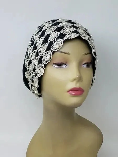 Black and white embellished turban headwrap on mannequin, two tone modest headwear with pearl and bead details, snug comfortable fit for special occasions, front and side view