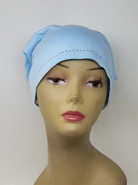 Light blue hijab undercap displayed on mannequin head, smooth fitted design for modest wear, breathable comfortable under scarf cap for daily use, full coverage headwear accessory for women
