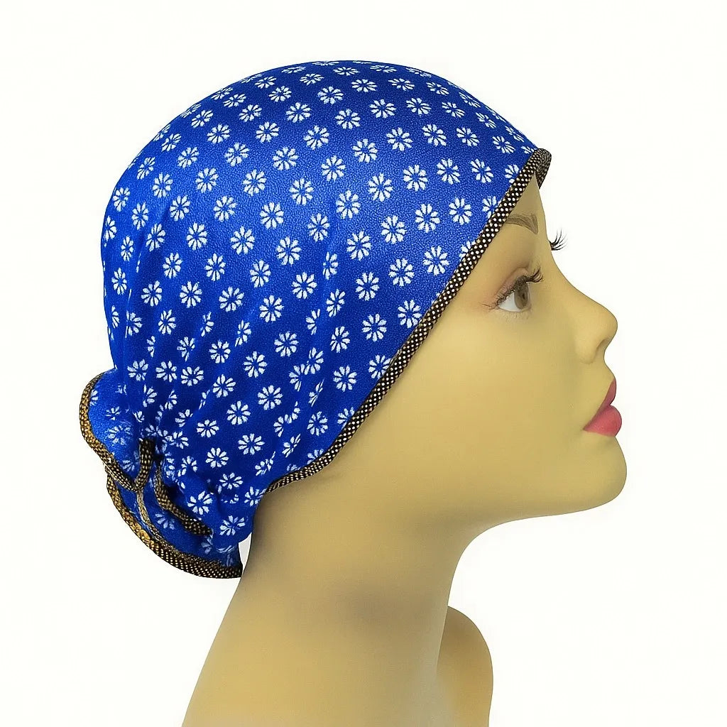 Blue patterned sleep bonnet cap worn on mannequin head, modest hair protection bonnet for sleeping, breathable women hair cap, protective night bonnet from Affordable Hijab USA