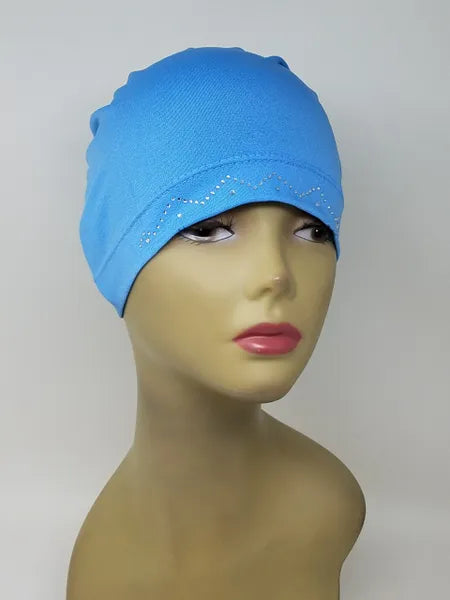 Blue stretch cap hijab on mannequin, soft fitted undercap for women, breathable modest headwear, smooth snug fit, lightweight fabric, bright blue hijab cap for layering under scarves or daily wear