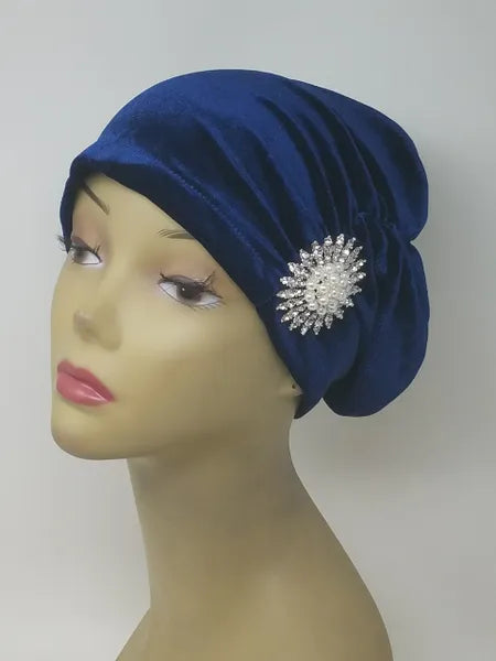 Blue turban headwear for women with flower detail, soft stretch fabric head covering, ready to wear turban hat, full coverage modest headwear, lightweight breathable turban, slip on hijab alternative, comfortable daily wear turban, stylish blue turban for women, chemo headwear option, easy wear head covering