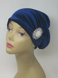 Blue turban headwear for women with flower detail, soft stretch fabric head covering, ready to wear turban hat, full coverage modest headwear, lightweight breathable turban, slip on hijab alternative, comfortable daily wear turban, stylish blue turban for women, chemo headwear option, easy wear head covering