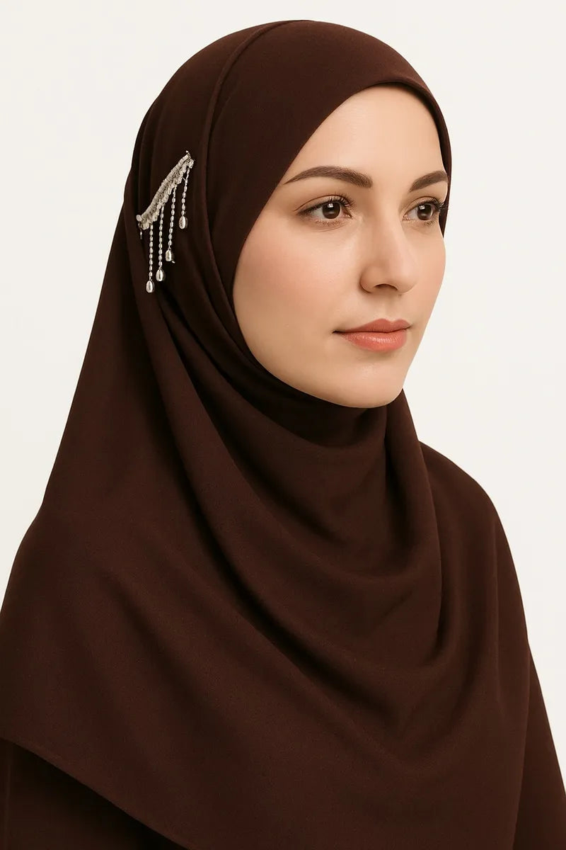 Brown chiffon hijab scarf with decorative brooch detail, lightweight modest headscarf for women on white background