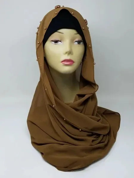 Brown hijab scarf wrapped on mannequin, modest full coverage head scarf, simple plain hijab style, elegant, draped wrap look, warm brown color scarf for women, everyday modest fashion accessory, smooth flowy appearance, neutral tone hijab for daily wear