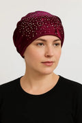 Burgundy rhinestone bun turban cap for women with sparkling crystal rhinestones on soft stretch fabric. Modest hijab headwear with built-in bun design for elegant styling, comfortable slip-on turban cap for prayer, daily wear, special occasions, and modest fashion outfits.