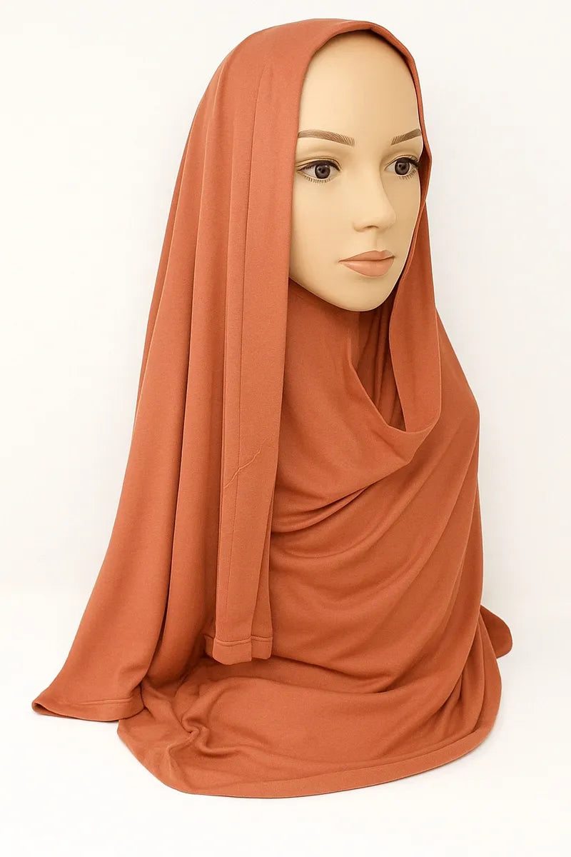 Burnt orange full drape khimar hijab in heavy jersey fabric with long front and back coverage, modest Islamic prayer hijab for women, soft stretch rust layered khimar from Affordable Hijab USA