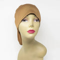 Camel instant hijab cap worn on mannequin, modest Muslim head covering for women, soft stretch hijab underscarf cap for secure everyday hijab styling and comfortable all day wear.