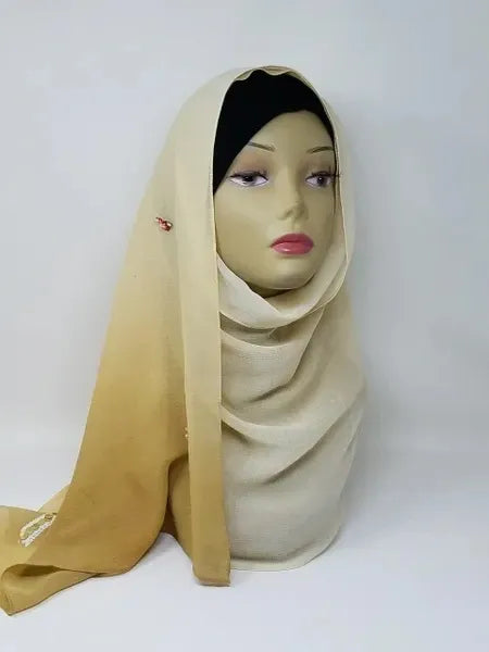 Champagne chiffon hijab scarf on mannequin with soft flowing lightweight fabric, breathable modest headscarf for women, elegant smooth drape hijab for everyday wear and formal occasions