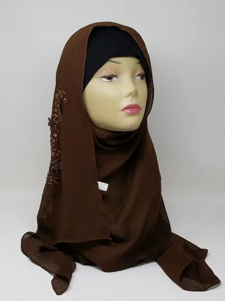 Chocolate brown chiffon hijab scarf displayed on mannequin, rich deep brown flowy fabric, lightweight breathable modest headscarf for women, elegant drape chiffon hijab for everyday and formal wear, smooth soft scarf from Affordable Hijab USA