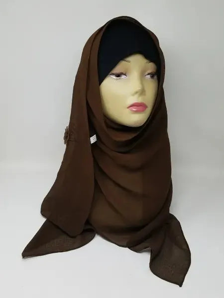 Dark brown chiffon hijab draped on mannequin, soft breathable scarf for modest wear, lightweight smooth fabric, flowy elegant texture, deep brown hijab for everyday styling and formal outfits