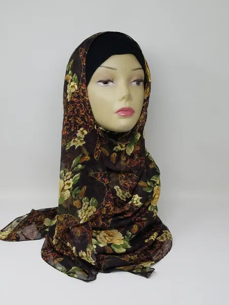 Dark floral georgette hijab draped on mannequin, lightweight breathable scarf with mixed floral pattern, soft textured matte fabric, flowy elegant modest head covering for women, stylish hijab for everyday wear and special occasions