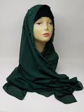 Dark green hijab scarf wrapped on mannequin, modest full coverage head scarf, elegant draped wrap style, plain simple hijab for everyday wear, deep green color scarf, modest fashion accessory for women, smooth flowy look, neutral classic hijab styling