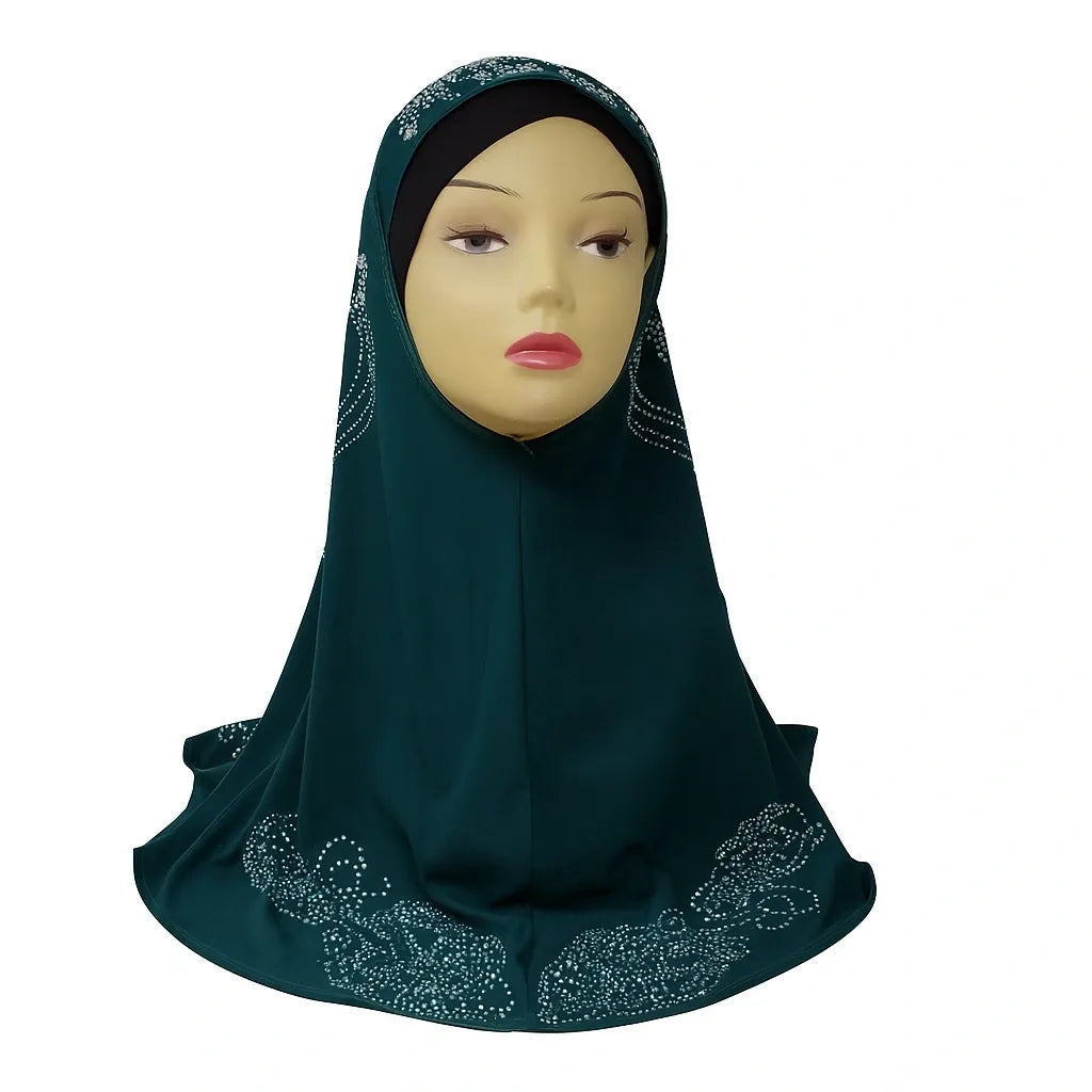 Dark green hijab with embellishments on a mannequin head against a white background