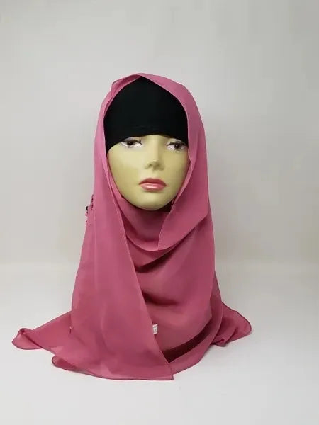 Dusty rose chiffon hijab scarf displayed on mannequin, soft muted pink flowy fabric, lightweight breathable modest headscarf for women, elegant drape chiffon hijab for everyday wear and special occasions, Affordable Hijab USA