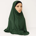 Model wearing emerald green full coverage khimar hijab with soft flowing drape and lightweight breathable fabric, modest Islamic head covering for women, front and side view on white background