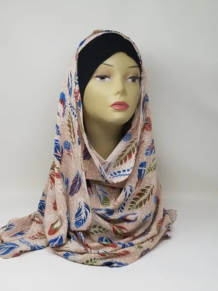 Floral patterned modest hijab scarf in soft fabric displayed on mannequin, lightweight Islamic headscarf for everyday wear, modest fashion hijab for Muslim women, elegant floral design hijab for casual and formal outfits