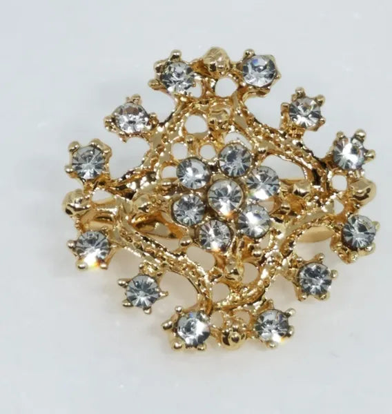 Gold crystal snowflake hijab brooch pin with rhinestones, decorative scarf brooch accessory for securing hijab, elegant modest fashion jewelry for scarves and shawls