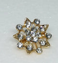 Gold crystal sunburst hijab brooch pin with rhinestones, decorative starburst scarf brooch accessory for securing hijab, elegant modest fashion jewelry for scarves and shawls