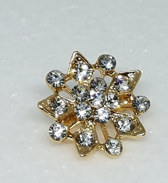 Gold crystal sunburst hijab brooch pin with rhinestones, decorative starburst scarf brooch accessory for securing hijab, elegant modest fashion jewelry for scarves and shawls