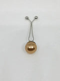 Gold pearl hijab pull pin used to secure scarves and hijabs, elegant modest fashion accessory with decorative pearl bead.