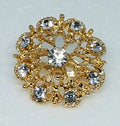 Gold rhinestone flower brooch pin for hijab styling, elegant crystal hijab pin brooch accessory for scarves, abayas, and modest fashion outfits, decorative gold floral pin for securing hijabs and shawls, luxury modest fashion accessory for women, sparkling crystal brooch for hijab, scarf brooch jewelry for elegant modest wear.
