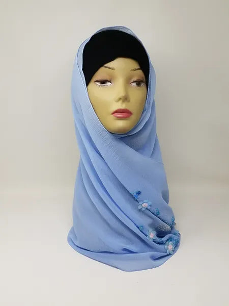 Light blue chiffon hijab scarf displayed on mannequin, soft flowy fabric, breathable lightweight modest headscarf for women, elegant everyday hijab styling, smooth drape chiffon scarf for casual and formal wear, Affordable Hijab USA product