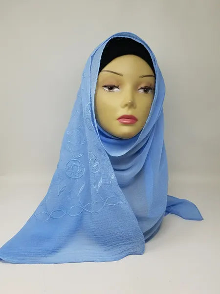 Light blue chiffon hijab draped on mannequin, soft breathable scarf for modest wear, lightweight smooth fabric, flowy elegant texture, pastel blue hijab for everyday outfits and special occasions