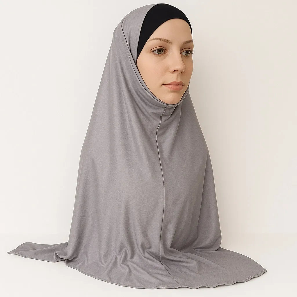 Model wearing light gray full coverage khimar hijab with soft flowing drape and lightweight breathable fabric, modest Islamic head covering for women, front and side view on white background