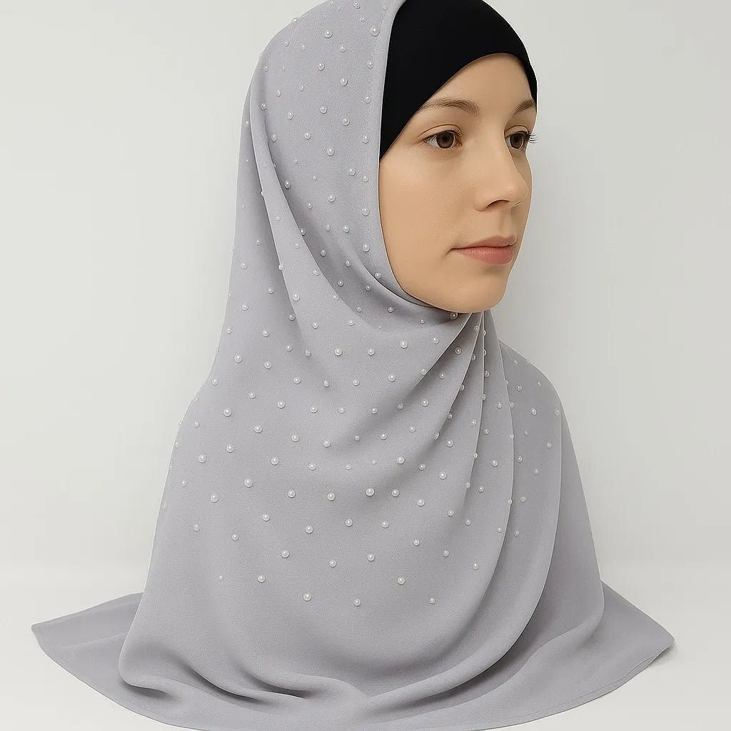 Light grey chiffon hijab with soft drape and full coverage styled on model with black undercap, modest fashion scarf for everyday wear in the USA