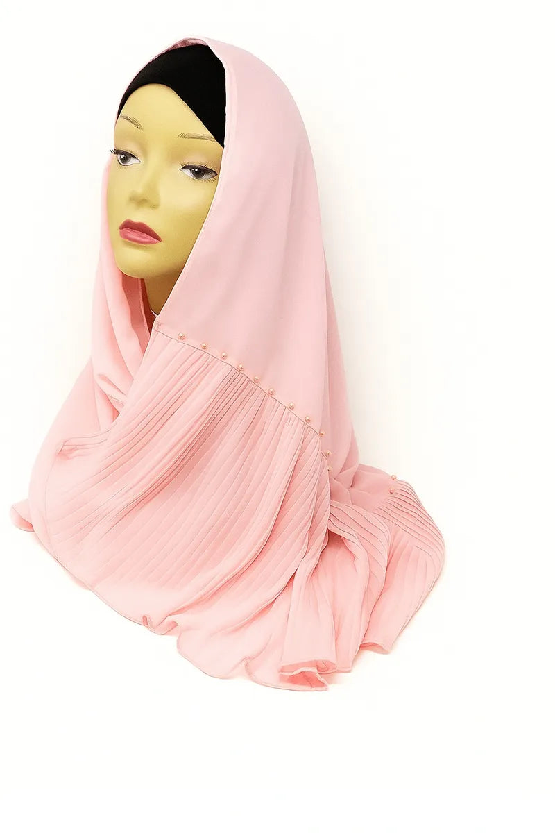 Light pink chiffon hijab scarf made from soft lightweight fabric, elegant modest Muslim headscarf draped on mannequin for breathable everyday hijab styling.
