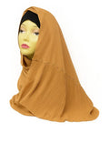 Mustard chiffon hijab scarf made from lightweight flowing fabric, elegant modest Muslim headscarf styled on mannequin for breathable everyday hijab wear.