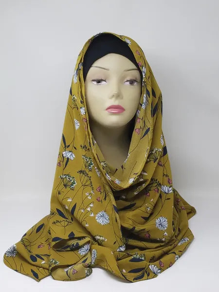 Mustard yellow floral print hijab scarf for Muslim women, lightweight modest headscarf with floral pattern, elegant draped hijab for everyday wear, prayer, work, and modest fashion styling