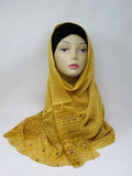 mustard gold hijab scarf on mannequin soft draped headscarf modest muslim wrap elegant textured fabric lightweight breathable everyday wear