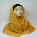mustard yellow hijab scarf soft modest headscarf for women full coverage hijab smooth lightweight breathable fabric elegant drape comfortable daily wear Muslim scarf stylish mustard scarf simple plain hijab easy to style modest fashion accessory long yellow hijab scarf versatile wrap scarf for casual and formal outfits soft touch head covering