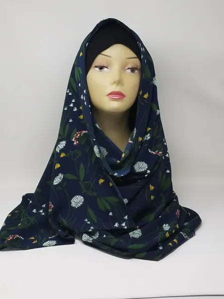 Navy blue floral print hijab scarf for Muslim women, lightweight modest headscarf with colorful floral pattern, elegant draped hijab for everyday wear, prayer, work, and modest fashion styling