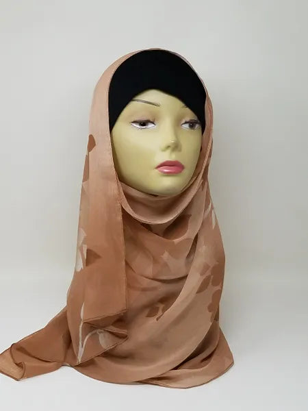 Nude beige hijab scarf on mannequin, soft lightweight modest headscarf for women, smooth flowy drape with full coverage style, neutral tone hijab for everyday wear, simple elegant wrap, breathable scarf, easy to style modest fashion accessory, front and side view