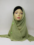 Olive green chiffon hijab scarf displayed on mannequin, soft flowy lightweight fabric, breathable modest headscarf for women, elegant drape chiffon hijab for everyday wear, smooth olive tone scarf from Affordable Hijab USA