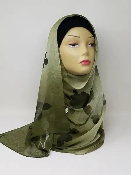 Olive green hijab scarf displayed on mannequin, modest headscarf with soft flowy drape, lightweight breathable wrap for women, full coverage hijab style, simple elegant olive scarf for everyday wear, easy to style modest fashion accessory, front and side view of green hijab