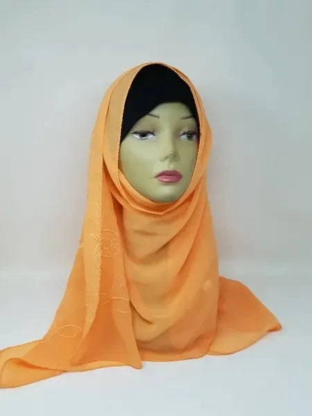 Bright orange chiffon hijab draped on mannequin, lightweight modest scarf for everyday wear, breathable fabric, smooth texture, elegant head covering for women, soft flowy hijab for casual and formal styling