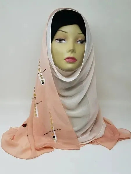 Peach chiffon hijab scarf with small embellishments on mannequin, soft lightweight breathable fabric, modest headscarf for women with elegant smooth drape for everyday and special occasion wear