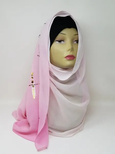 Pink chiffon hijab scarf on mannequin with soft flowing fabric, lightweight breathable modest headscarf for women, elegant smooth drape hijab for daily wear and special occasions