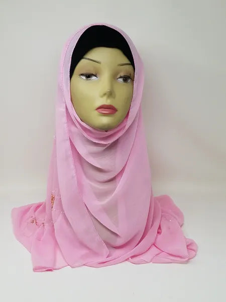 Soft pink chiffon hijab scarf on mannequin, lightweight breathable fabric, flowy modest headscarf for women, smooth texture elegant drape, perfect for everyday wear, prayer, and special occasions, stylish modest fashion chiffon hijab in solid pink color
